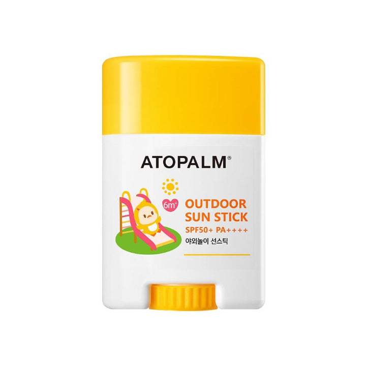 ATOPALM Outdoor Sun Stick SPF50+ PA++++ packaging. The packaging is primarily white and yellow with a cartoon illustration of a smiling sun and a bear.