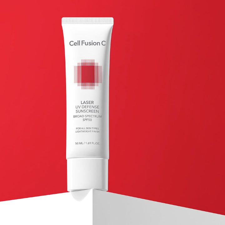 Tube of Cell Fusion Laser UV Defense Sunscreen on a red background