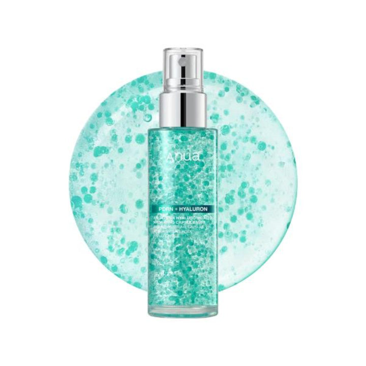 Anda Fresh + Hyaluron facial toner in a clear bottle with a silver pump, set against a circular light teal background filled with bubble-like speckles on a white studio background.